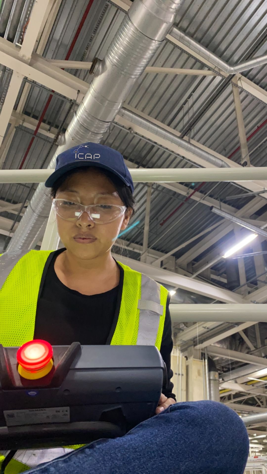 ICAP Engineer Sarai operating a robotic control pendant